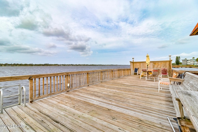 dock area with a deck with water view