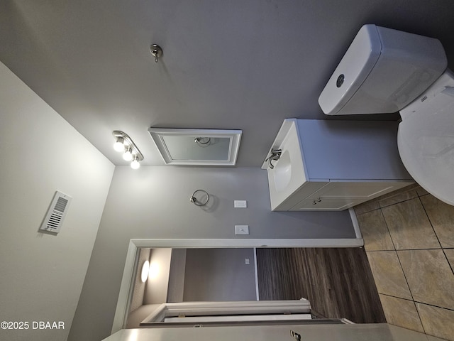 bathroom with tile patterned flooring and visible vents