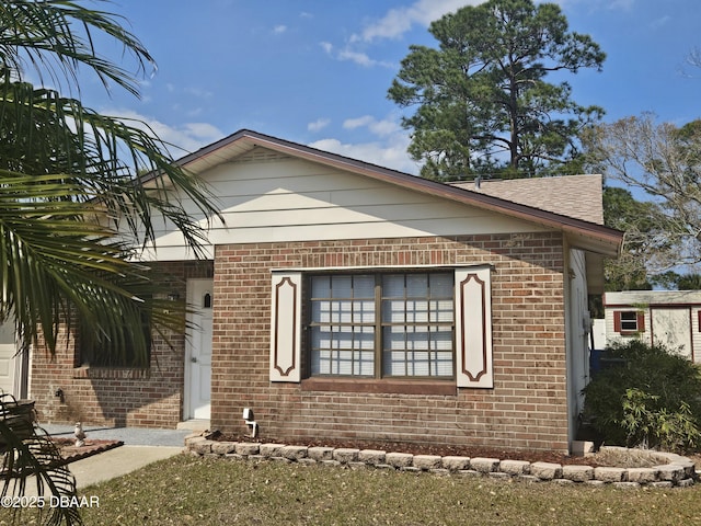 view of front facade featuring brick siding