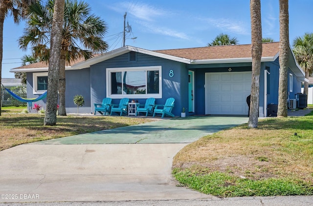 8 Camellia Dr, Ormond Beach, FL 32176 - ranch-style home featuring a garage, stucco siding, driveway, and a front yard