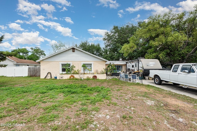 view of front of property with fence and a front yard