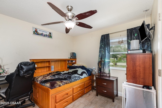 bedroom with baseboards and ceiling fan