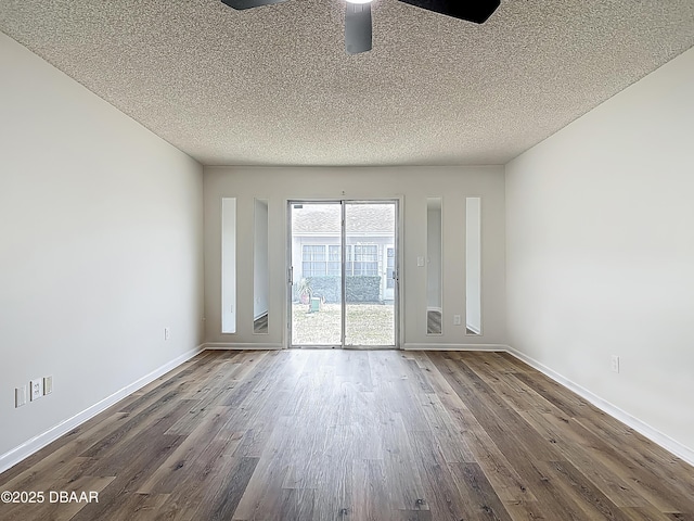 244 Oakleigh Dr, Deland, FL 32724 - unfurnished room featuring dark wood-type flooring, a textured ceiling, and baseboards