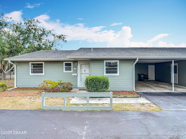 244 Oakleigh Dr, Deland, FL 32724 - ranch-style home with an attached carport, asphalt driveway, and roof with shingles
