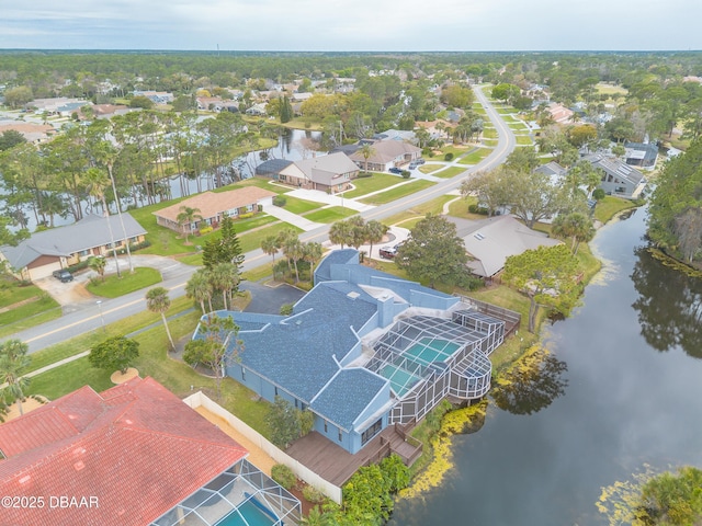 bird's eye view with a water view and a residential view