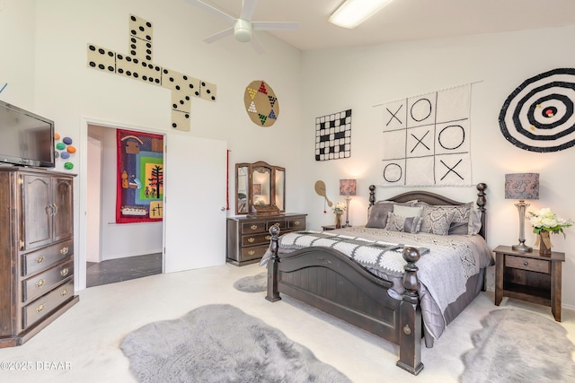 carpeted bedroom featuring high vaulted ceiling