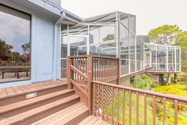 wooden terrace featuring a lanai