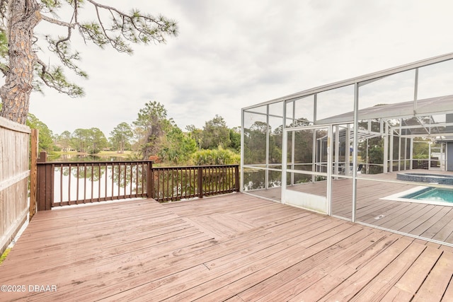 wooden deck with glass enclosure and a pool