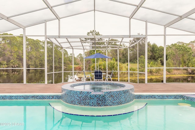 view of swimming pool featuring glass enclosure, a deck, and a pool with connected hot tub