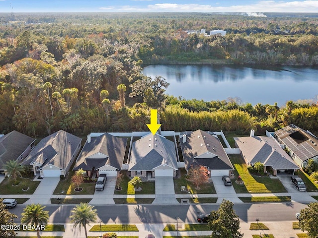 birds eye view of property with a water view