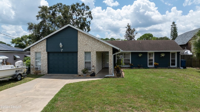 view of front of house with a garage and a front lawn