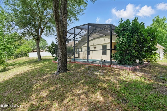 3348 Heath Dr, Deltona, FL 32725 - rear view of property with an outdoor pool, a lawn, a lanai, and stucco siding