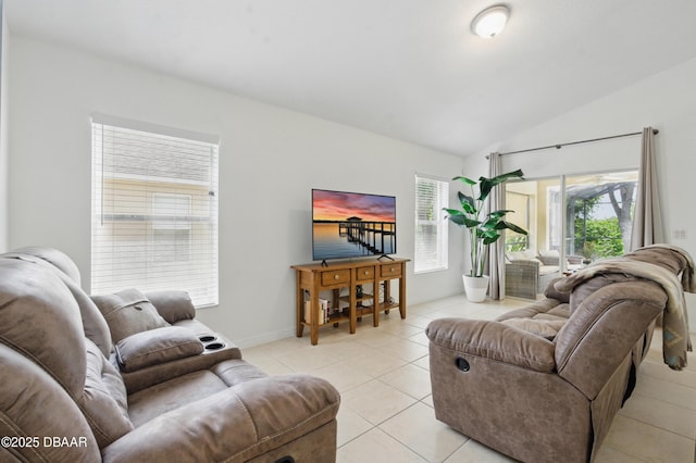 3348 Heath Dr, Deltona, FL 32725 - living area featuring vaulted ceiling and light tile patterned floors