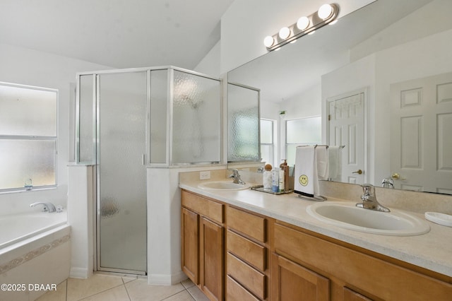 3348 Heath Dr, Deltona, FL 32725 - bathroom with a stall shower, double vanity, tile patterned floors, and a garden tub