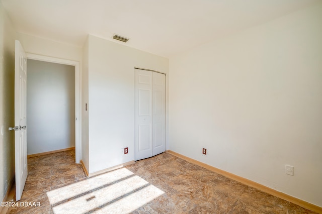 unfurnished bedroom with a closet