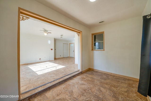 spare room featuring ceiling fan