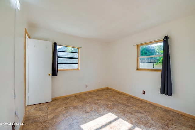 unfurnished room with plenty of natural light