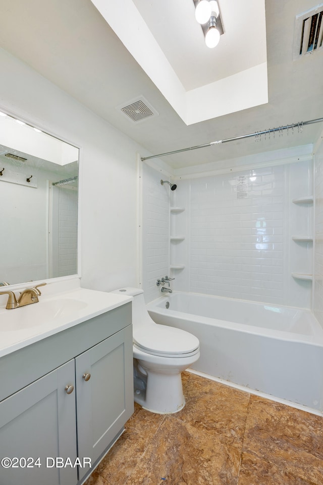 full bathroom featuring vanity, toilet, and tiled shower / bath combo