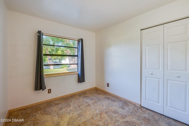 unfurnished bedroom featuring a closet