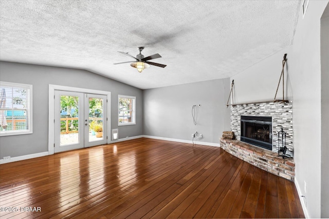 unfurnished living room with wood-type flooring, french doors, vaulted ceiling, and ceiling fan