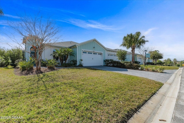 ranch-style house with a garage and a front yard