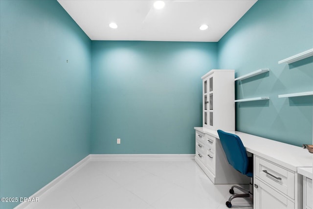 office space featuring built in desk and light tile patterned floors