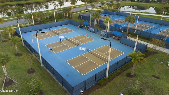 view of basketball court with a water view