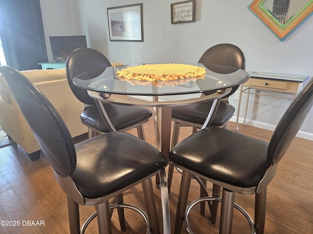 dining area with wood-type flooring