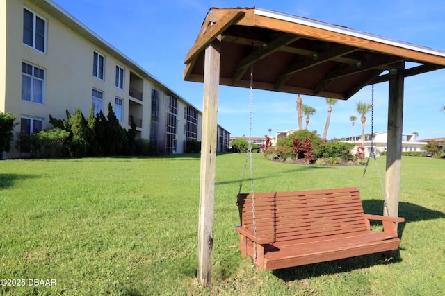 view of home's community with a lawn