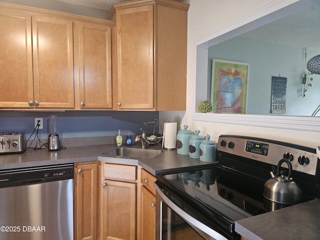 kitchen featuring sink, a textured ceiling, and appliances with stainless steel finishes