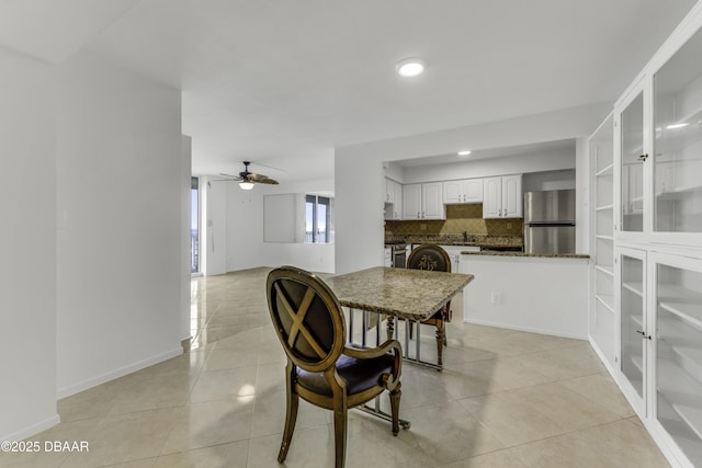2800 N Atlantic Ave Unit 1712, Daytona Beach, FL 32118 - dining space featuring light tile patterned floors, a ceiling fan, and recessed lighting