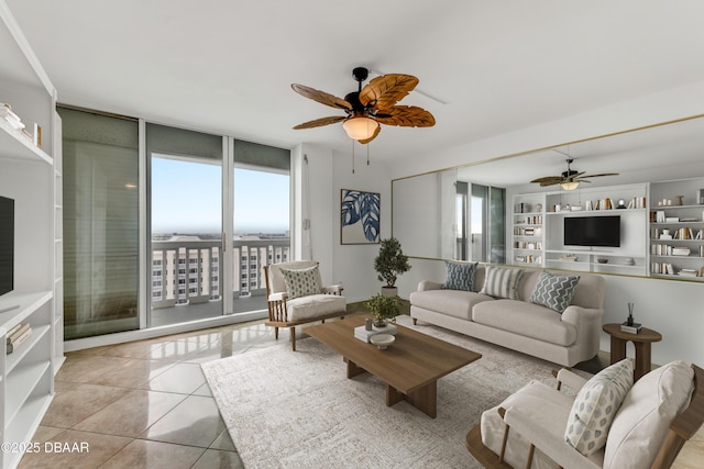 2800 N Atlantic Ave Unit 1712, Daytona Beach, FL 32118 - living area with a ceiling fan, a wall of windows, and light tile patterned floors