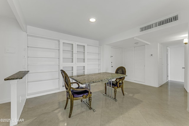 2800 N Atlantic Ave Unit 1712, Daytona Beach, FL 32118 - dining space with light tile patterned floors, built in shelves, and recessed lighting