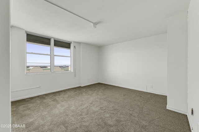 2800 N Atlantic Ave Unit 1712, Daytona Beach, FL 32118 - spare room with carpet flooring and baseboards