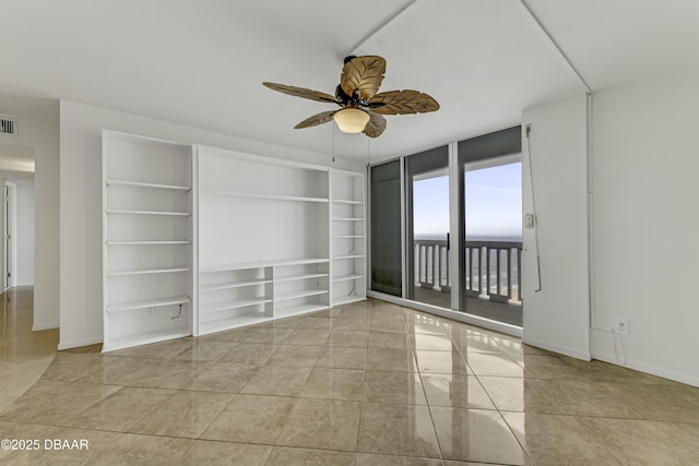 2800 N Atlantic Ave Unit 1712, Daytona Beach, FL 32118 - tiled spare room featuring ceiling fan and built in features