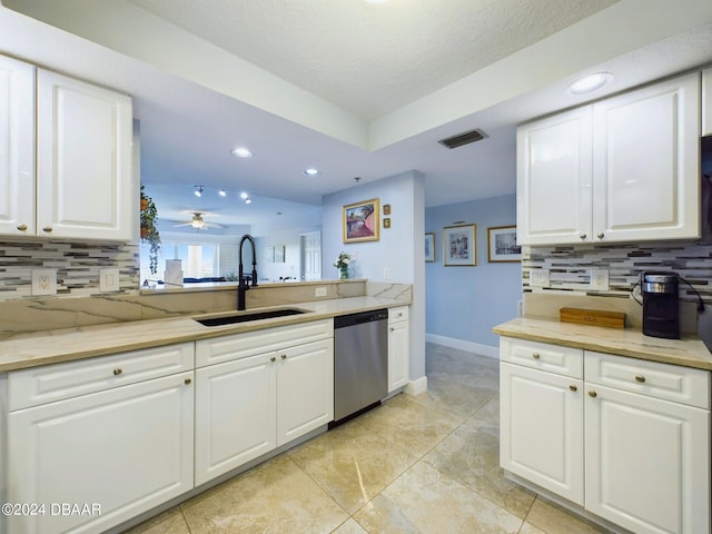 4670 Links Village Dr Unit C601, Ponce Inlet, FL 32127 - kitchen with stainless steel dishwasher, decorative backsplash, white cabinetry, recessed lighting, and a ceiling fan