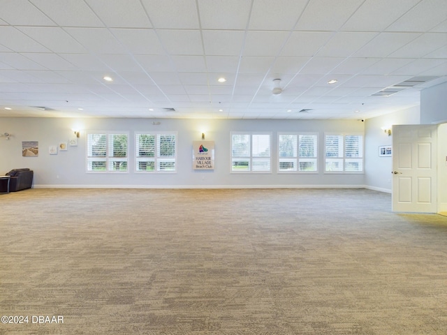 4670 Links Village Dr Unit C601, Ponce Inlet, FL 32127 - unfurnished living room featuring carpet flooring, a paneled ceiling, and recessed lighting