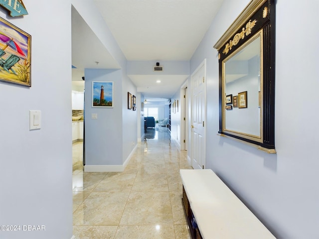 4670 Links Village Dr Unit C601, Ponce Inlet, FL 32127 - hall featuring baseboards and light marble finish flooring