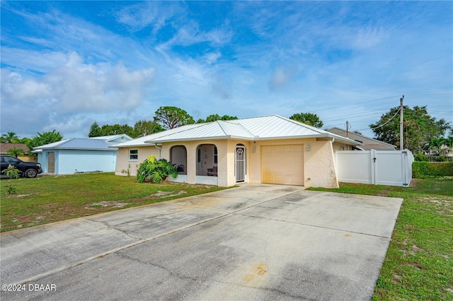 1320 Johns Cir, Merritt Island, FL 32952 - ranch-style home with an attached garage, a standing seam roof, stucco siding, metal roof, and driveway