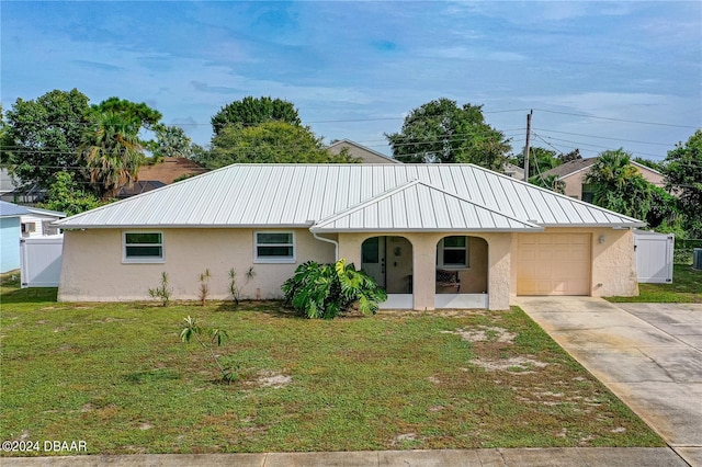 ranch-style home with a porch, a garage, and a front yard