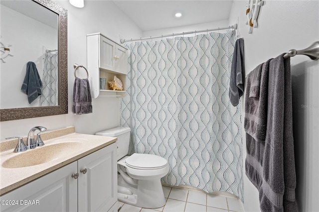 bathroom with tile patterned floors, vanity, and toilet