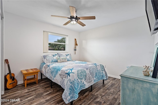 bedroom with ceiling fan and dark wood-type flooring