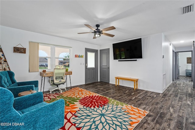 living room with dark hardwood / wood-style floors and ceiling fan