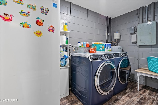 washroom with dark hardwood / wood-style flooring, independent washer and dryer, and electric panel