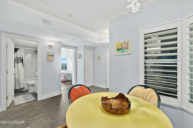 dining room with crown molding