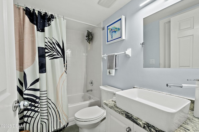 full bathroom featuring vanity, shower / bath combination with curtain, and toilet