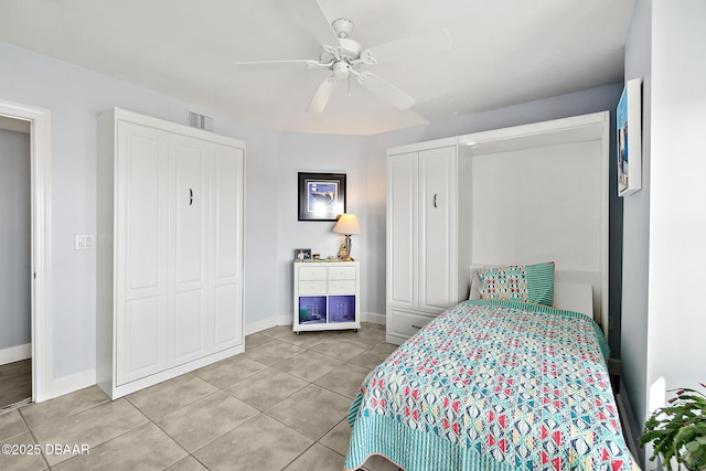 tiled bedroom with ceiling fan