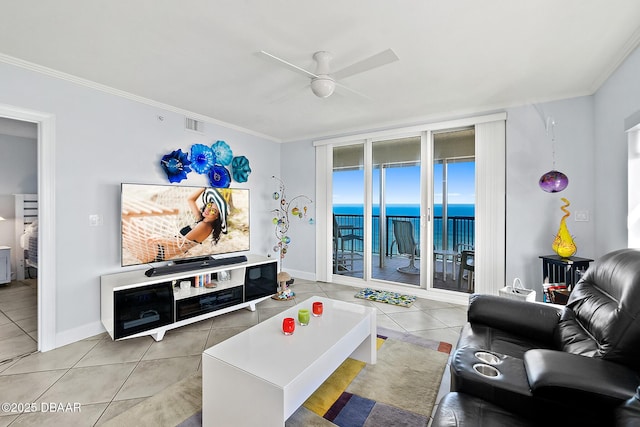 living room featuring crown molding, ceiling fan, and tile patterned floors