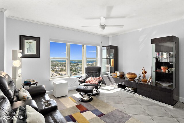 living room featuring ornamental molding, tile patterned floors, and ceiling fan