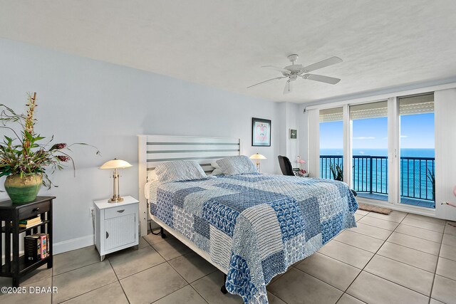 bedroom with a water view, ceiling fan, access to exterior, and light tile patterned floors